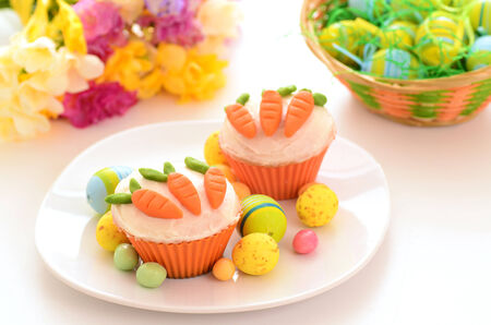 Easter cupcakes with candy carrotsの写真素材