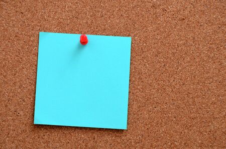 Blank notes pinned into brown corkboard