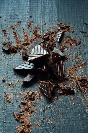 Shredded Dark Chocolate for Cooking on dark wooden backgroundの写真素材
