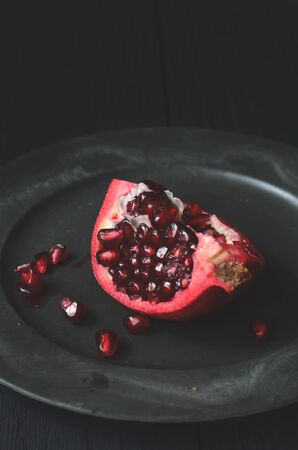 Pieces and grains of ripe pomegranate fruitの写真素材