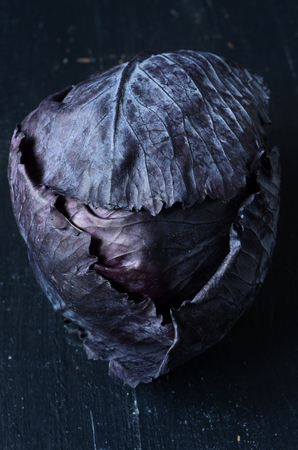 Red cabbage on wooden background close up shootの写真素材