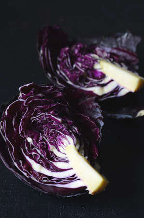 Red cabbage on wooden background close up shoot