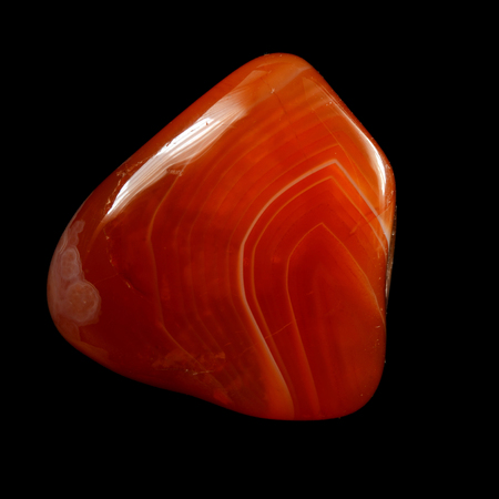 Red chalcedony (carnelian), isolated on black background