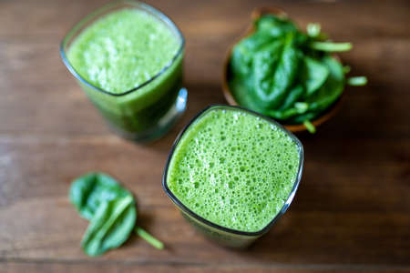 Spinach smoothie made with banana, baby spinach and spirulina powder