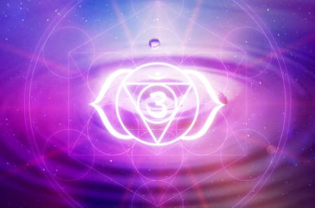 Ajna Chakra symbol on a purple background. This is the sixth Chakra, also called The Third Eye Chakraの写真素材