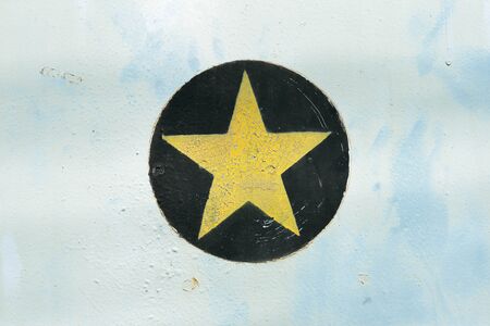Star yellow on metal backgroundの写真素材