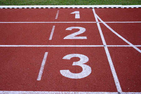 running track numbers one two three in stadiumの写真素材