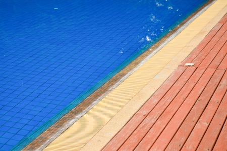 swimming pool blue water and wood flooringのeditorial素材