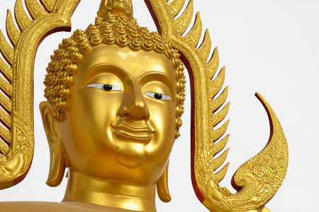 gold buddha face with white backgroundの写真素材