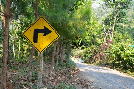 yellow right turn road signの写真素材