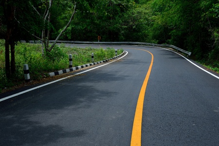 Asphalt road in the forestの写真素材