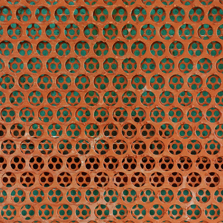 brown steel metal with circle perforated holes
