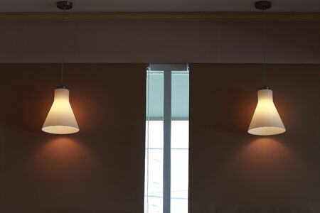 modern candelabrum open on dark wall backgroundの写真素材
