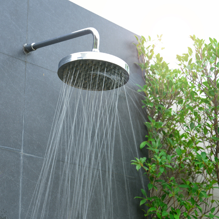 head shower water stream at swimming poolの写真素材
