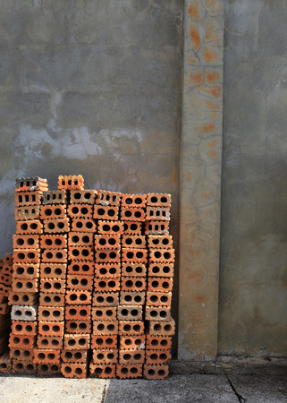 Stack of red bricks, bricks used for building constructionの写真素材