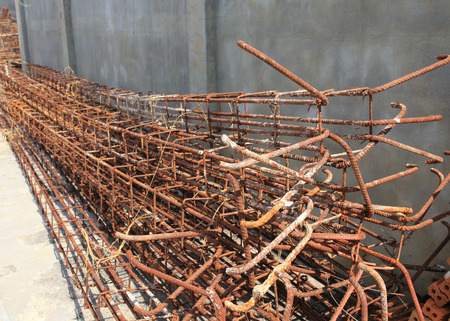 Steel rods used to reinforce concrete in construction siteの写真素材