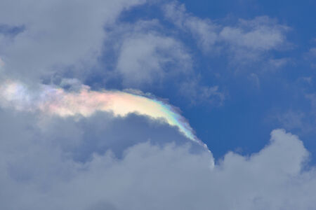 rainbow colorful clouds with blue sky backgroundの写真素材