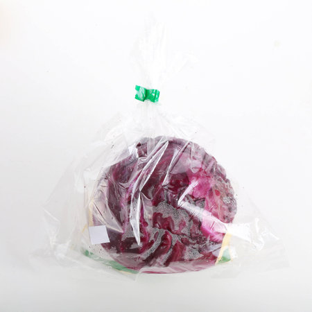 red cabbage wrapped in a plastic bagの写真素材