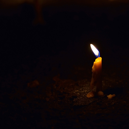 Candle light in the darkの写真素材
