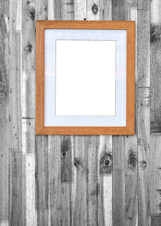 photo frame on wooden board backgroundの写真素材