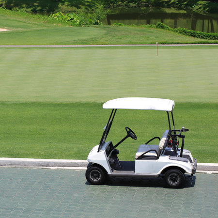 golf car in green golf courseの写真素材
