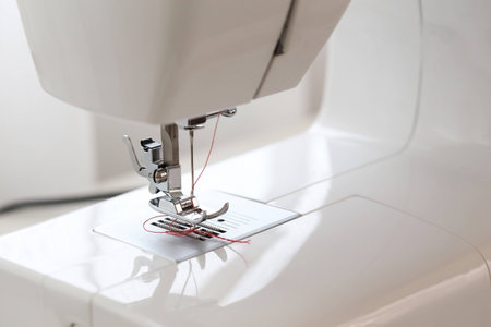 red thread in needle sewing machineの写真素材