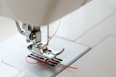 red thread in needle sewing machineの写真素材