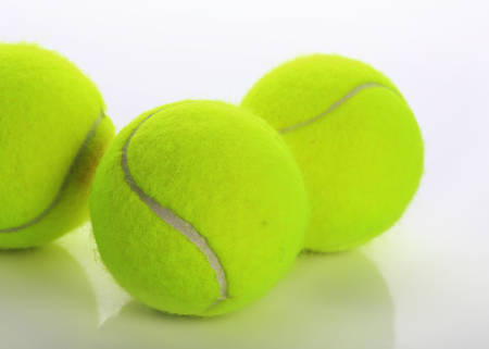 tennis ball isolated on white backgroundの写真素材