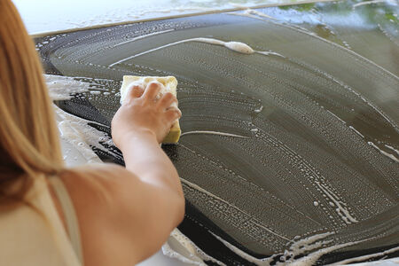 car wash, woman hand hold sponge washing car