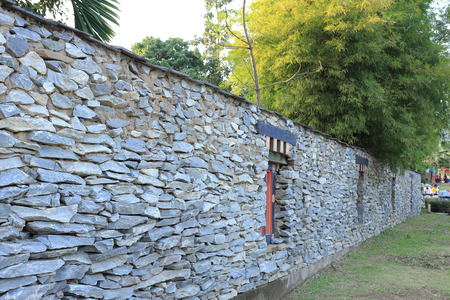 bhutan style fence stone and decorated garden with bambooの写真素材