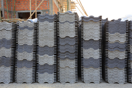 black tiles roof in building construction siteの写真素材
