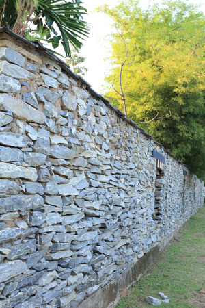 bhutan style fence stone and decorated garden with bambooの写真素材