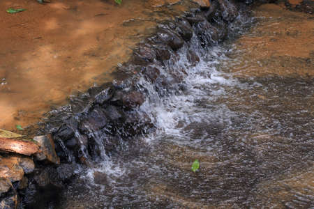 flowing water of waterfall in natureの写真素材