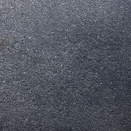 texture of black grain stone and cement backgroundの写真素材