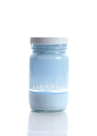 bottle glass of blue color on white backgroundの写真素材