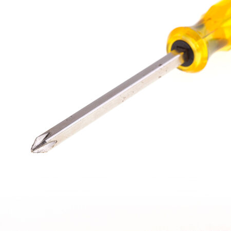 yellow screwdriver tool isolated on white backgroundの写真素材