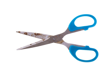 blue scissors rusty isolated on white backgroundの写真素材