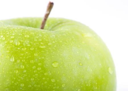 apple fruit with water drops isolated on white backgroundの写真素材