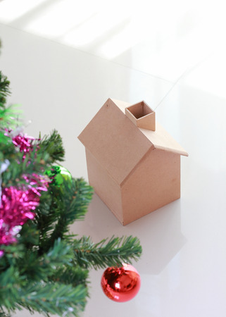 christmas decoration with small wooden house and treeの写真素材