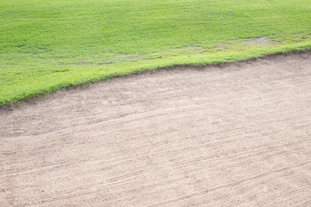 sand bunker and green grass of golf courseのeditorial素材