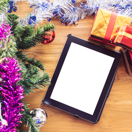 black tablet on table wood with christmas decorationの写真素材