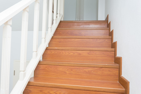 wooden staircase made from laminate wood in white modern houseの写真素材