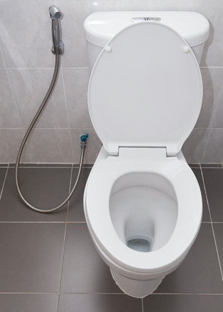 white flush toilet in modern bathroom interiorの写真素材