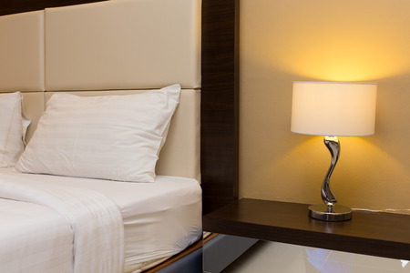 bedroom interior with bed and lamp decorationの写真素材