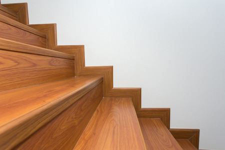 wooden staircase made from laminate wood in white modern houseの写真素材