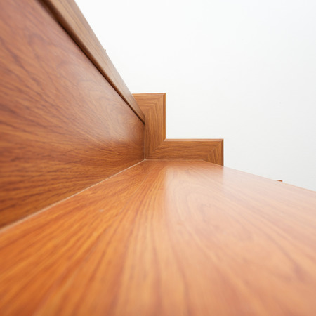 wooden staircase made from laminate wood in white modern houseの写真素材