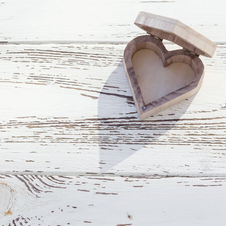 heart wooden box on white wood backgroundの写真素材