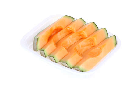 cantaloupe melon slice isolated on white backgroundの写真素材