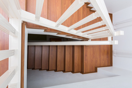 wooden staircase made from laminate wood in white modern houseの写真素材