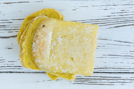 moldy bread on white table woodの写真素材